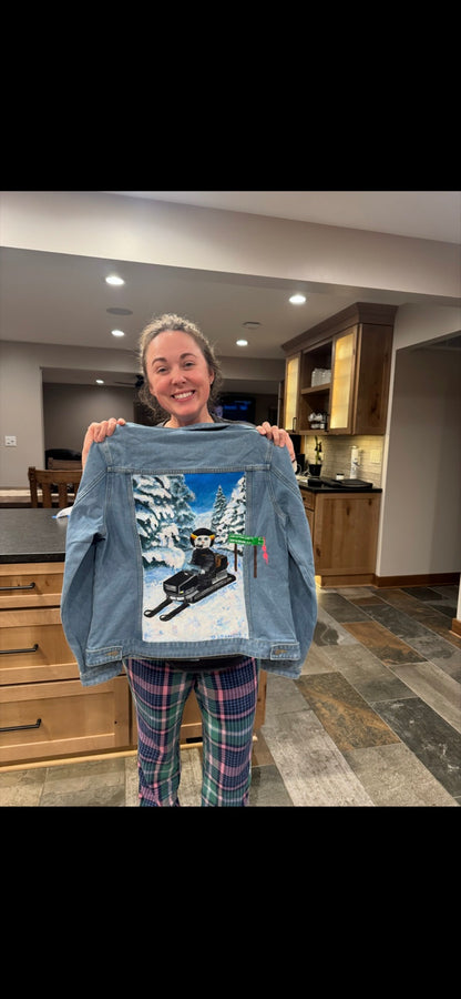 Sheila holding the snowmobile jacket